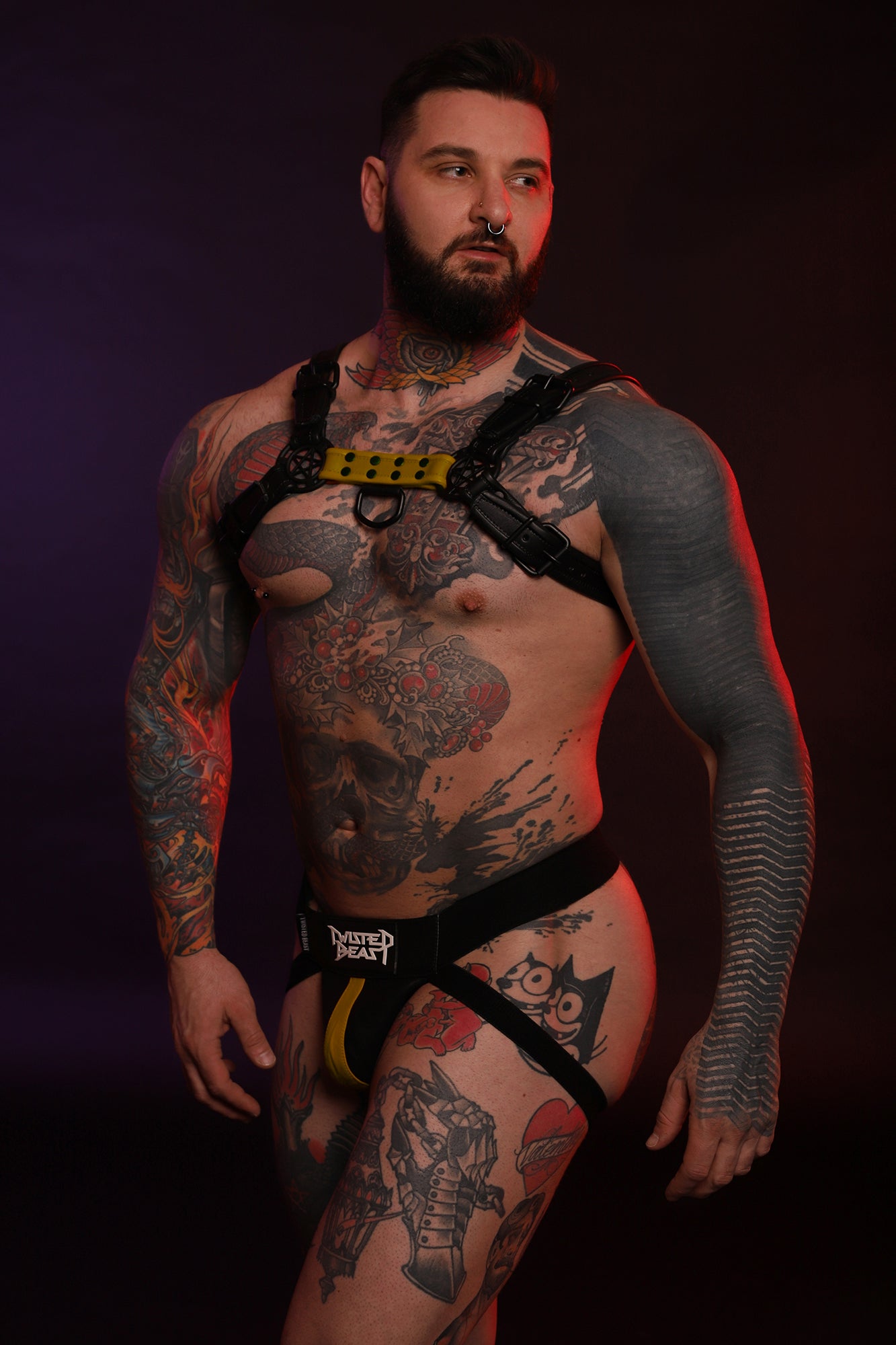 A model wearing a Beast Harness in yellow.