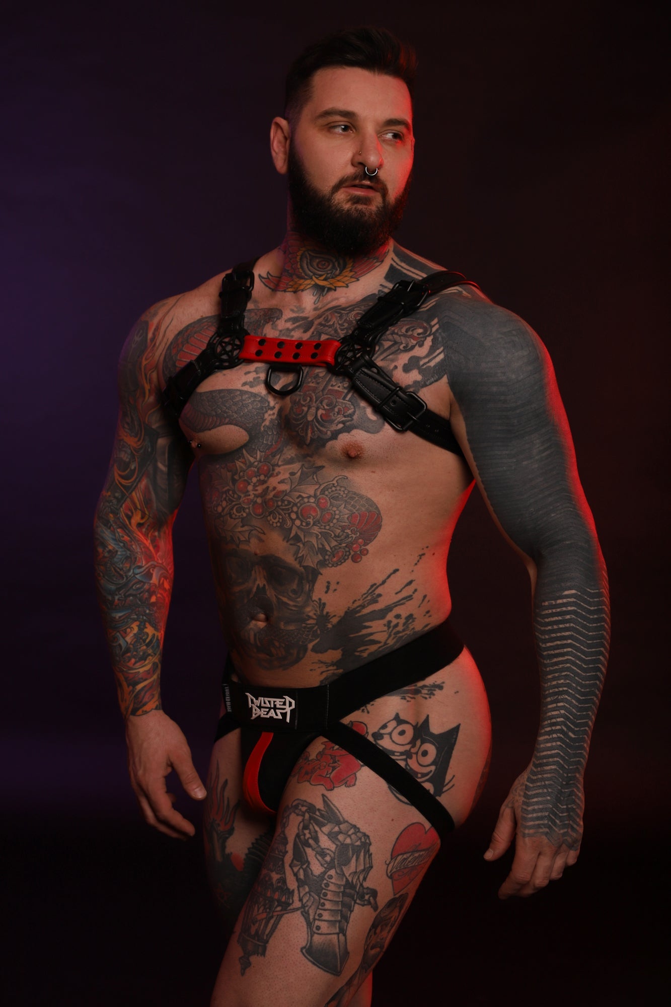 A product photo of a model wearing a red Beast Jock.