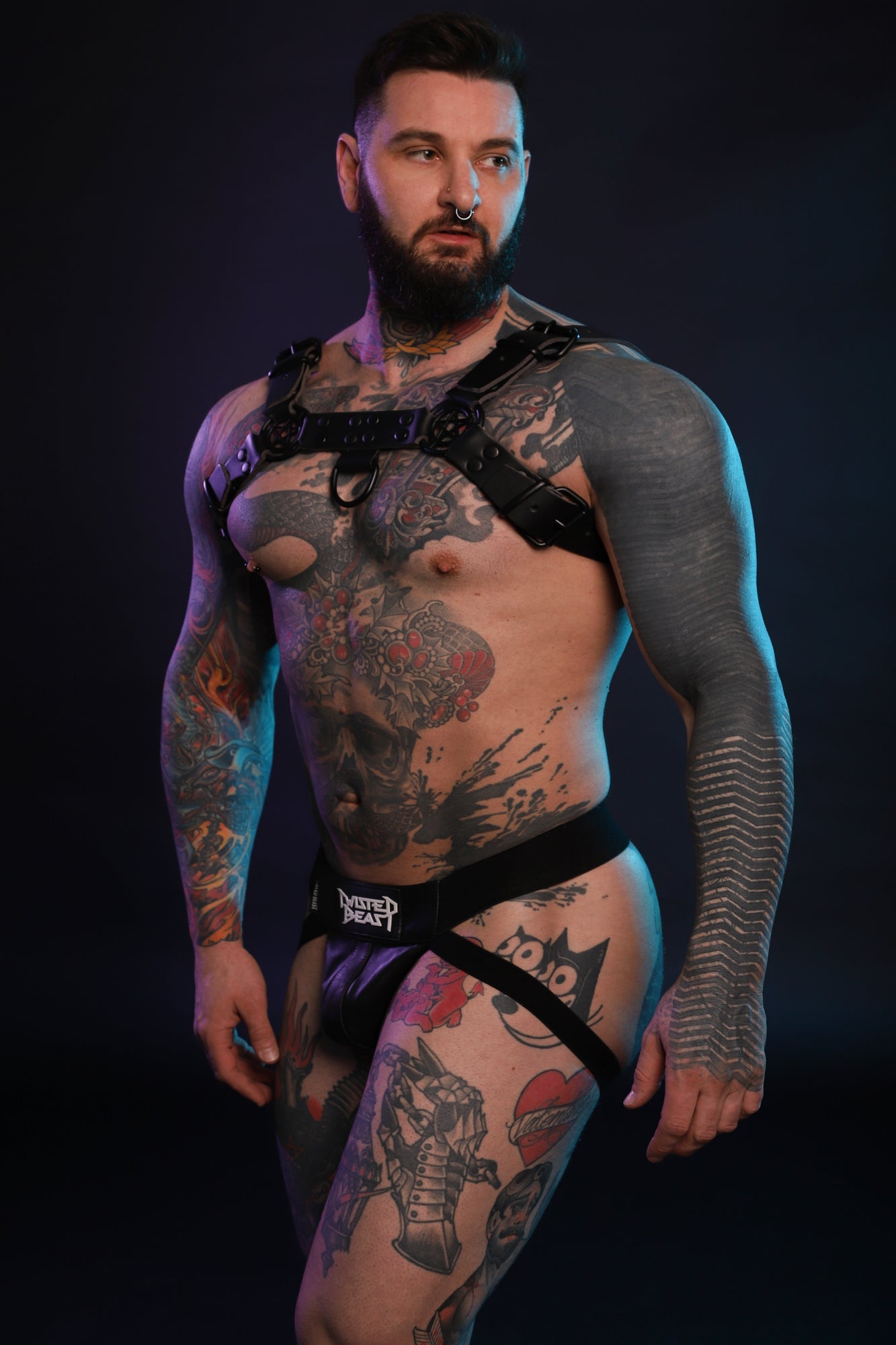 A model wearing a Beef Harness in black.