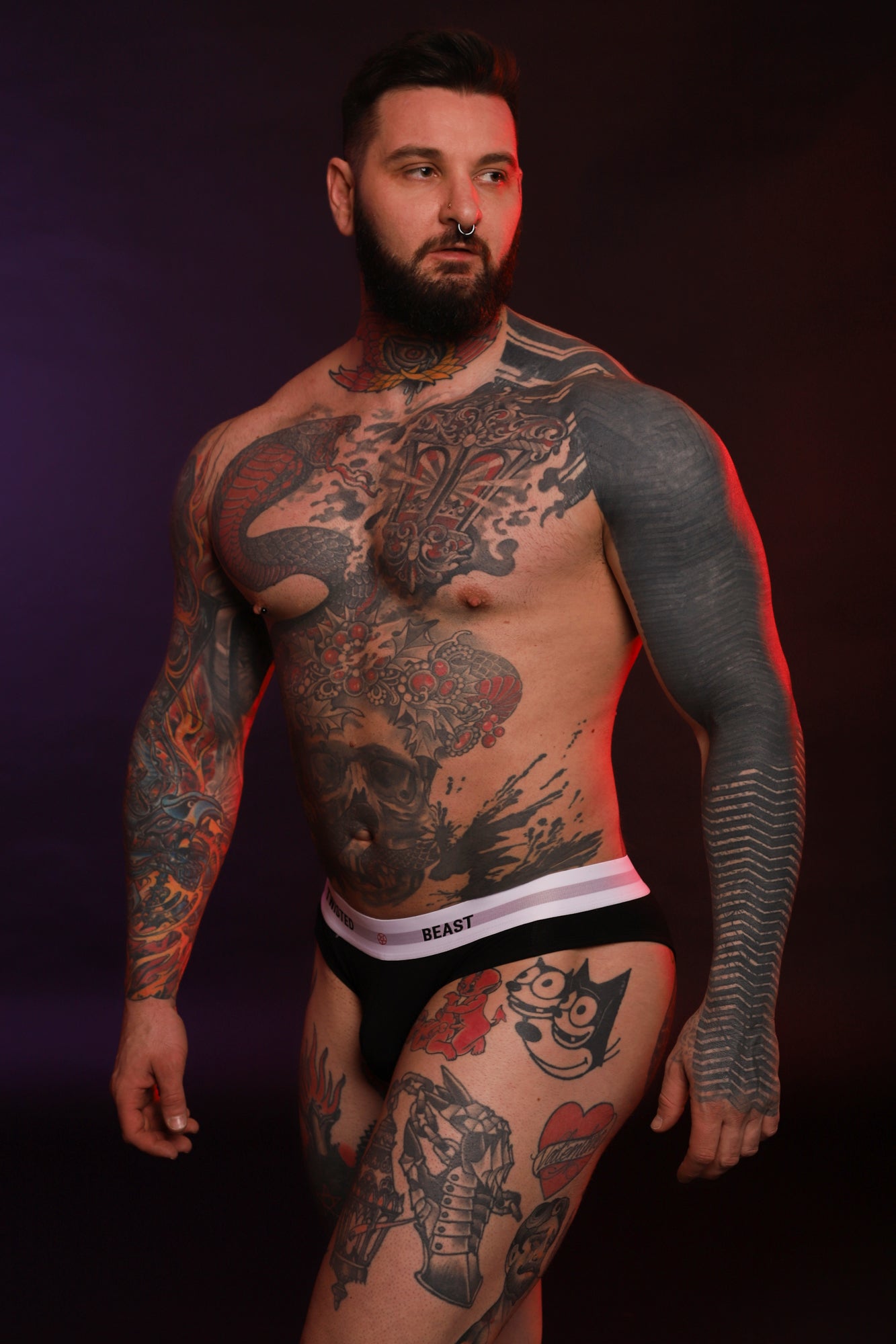 A model wearing a pair of Black Insignia Briefs.
