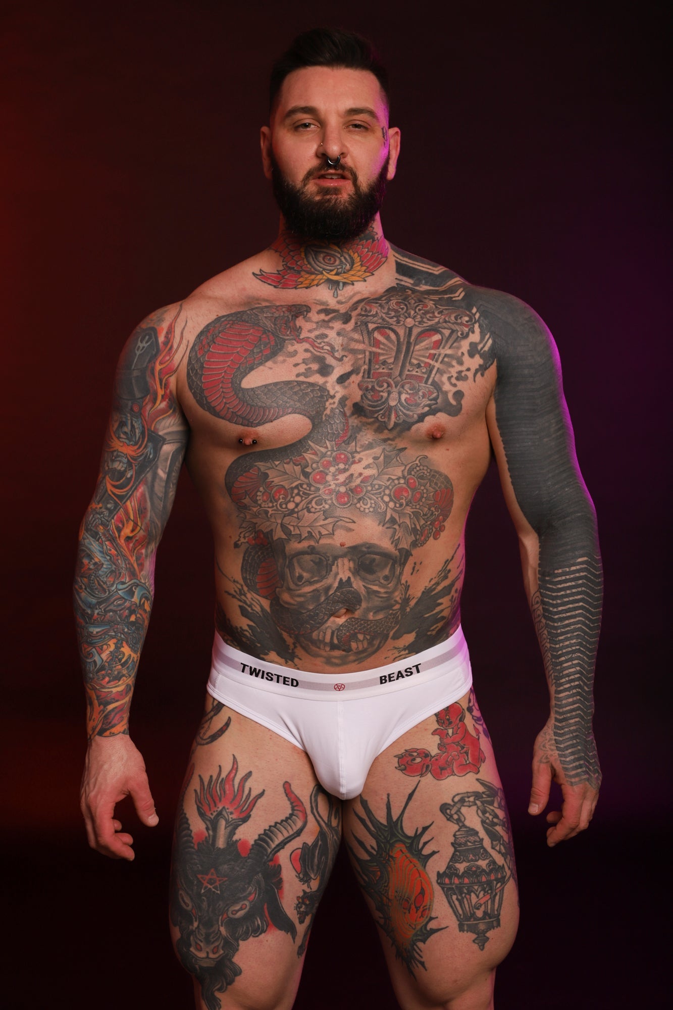 A model wearing a Twisted Beast Insignia Brief in white from the front.