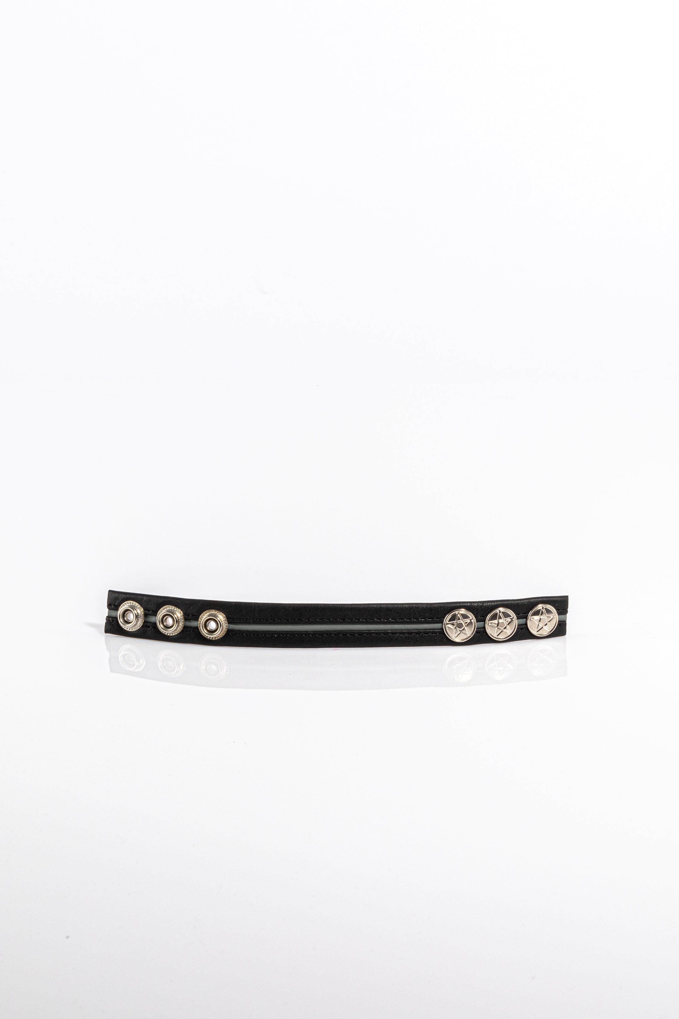 A product photo of a black cock ring with grey trim.