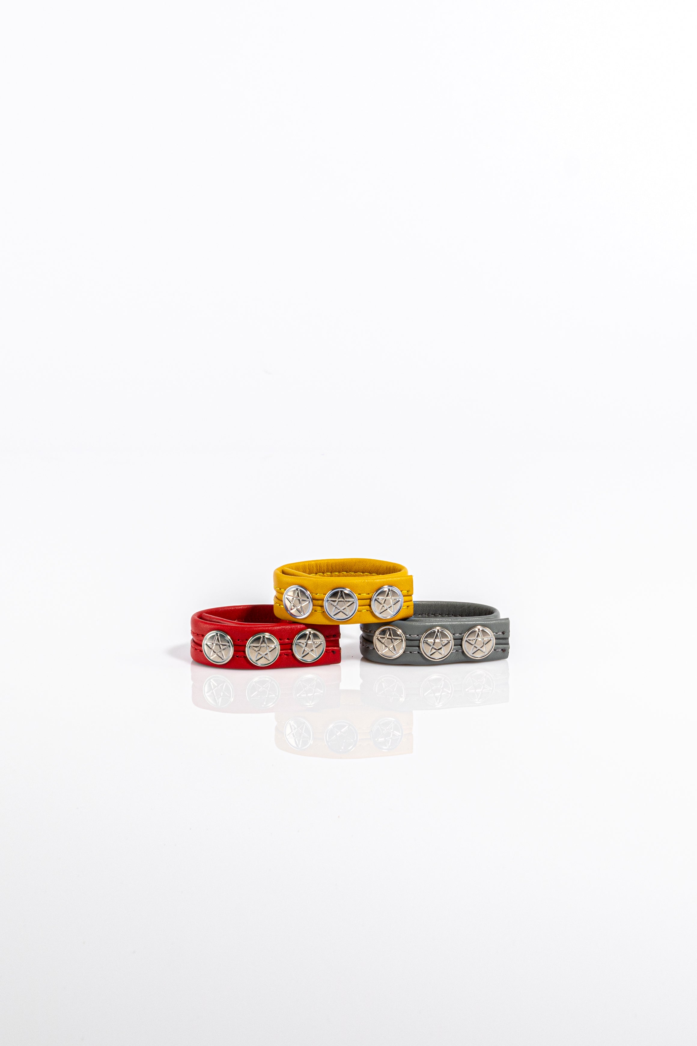 A product photo of three leather cock rings.