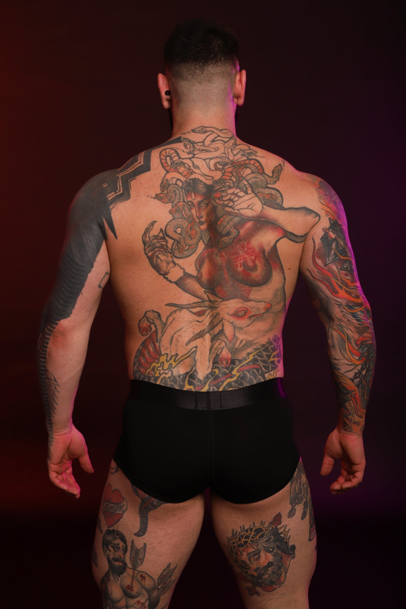 A back photograph of a Twisted Beast Model wearing Phantom Boxer in black.