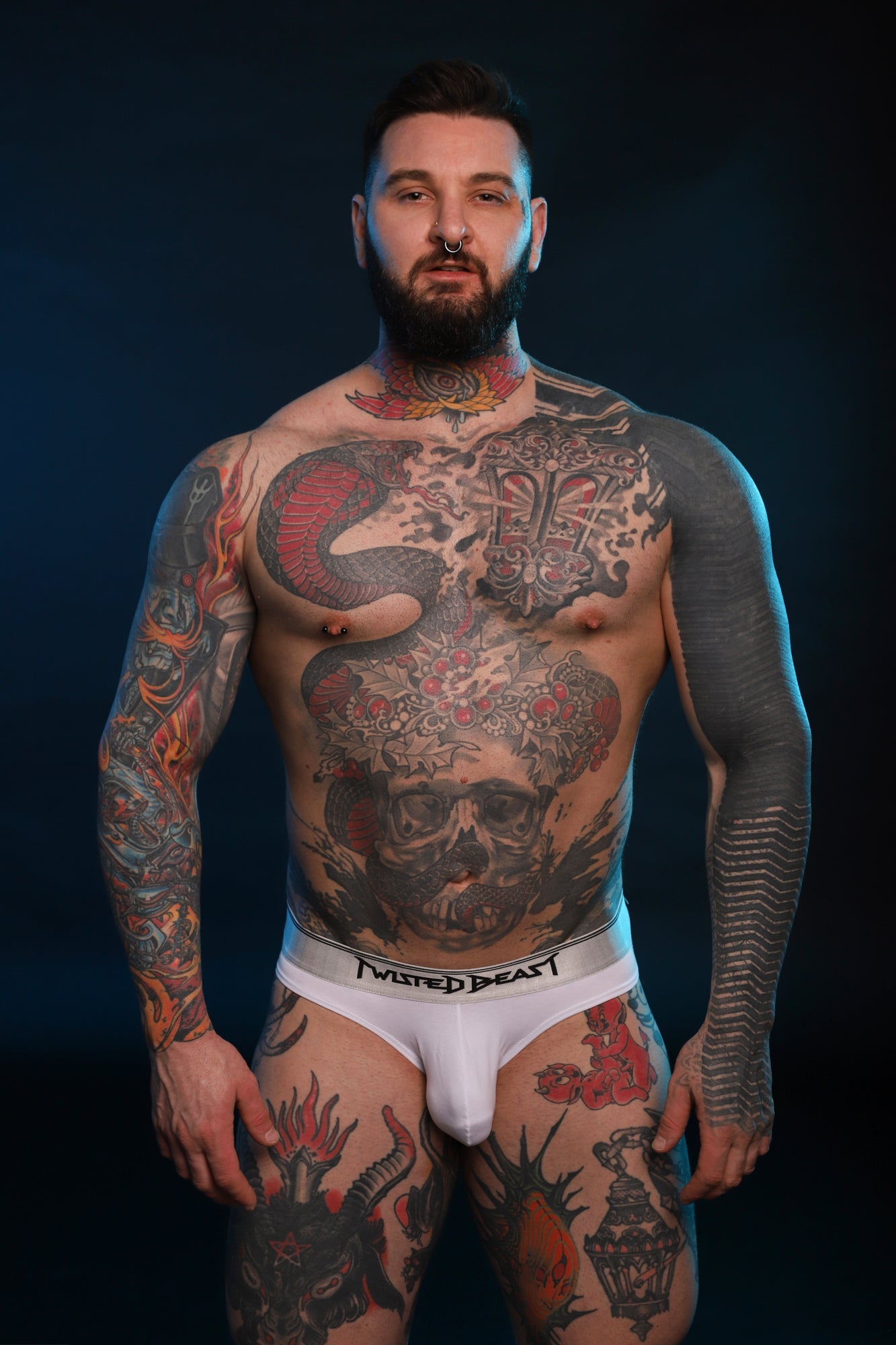 A model wearing a pair of Y2K Brief's made by Twisted Beast in white.
