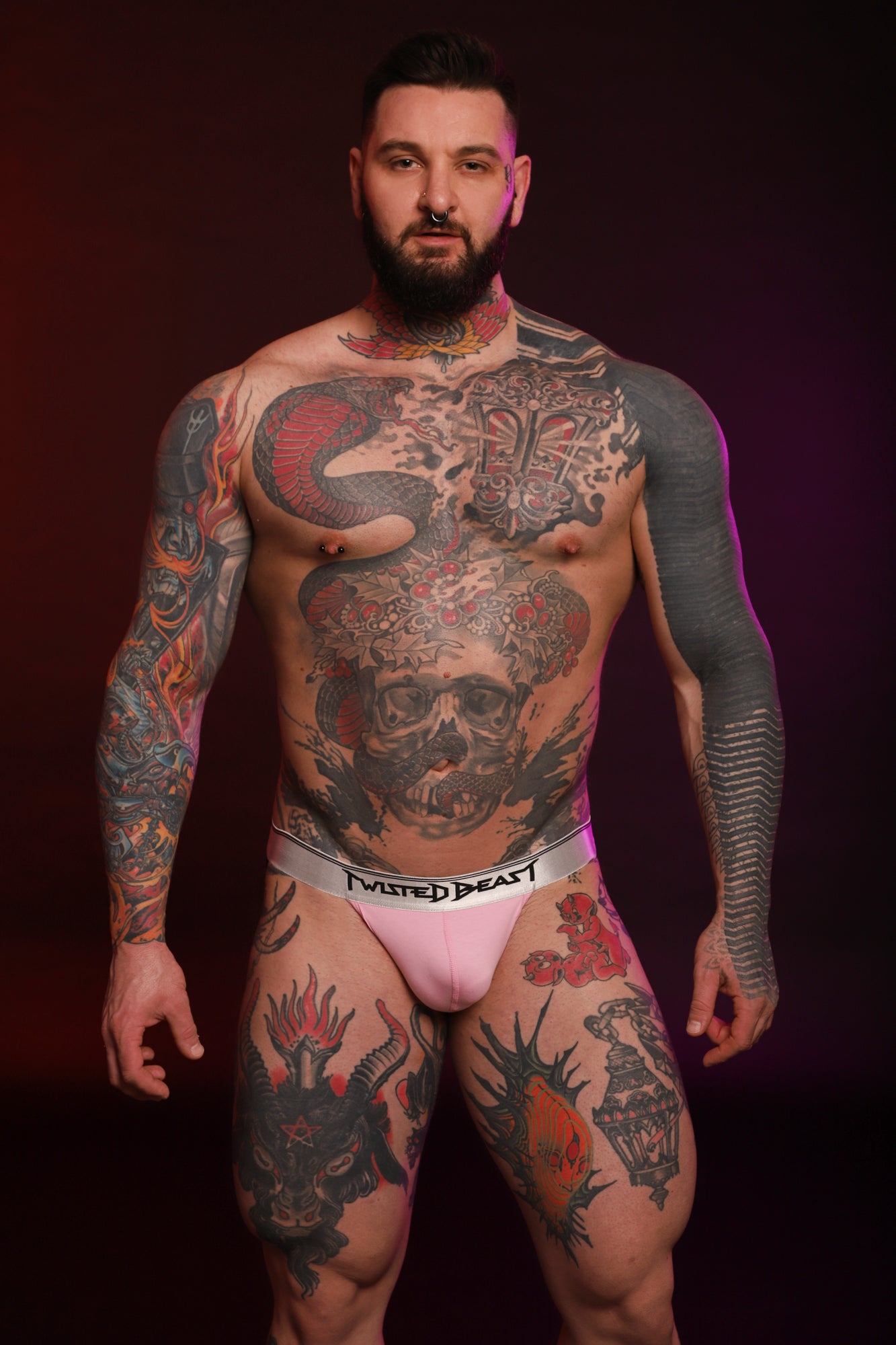 A photo of a model facing towards the camera while wearing a pink Y2K Jock.